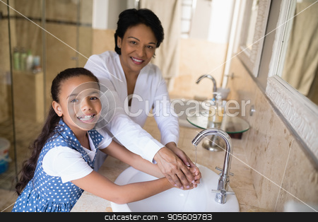 To use this stock image in your creative project, please select the size you need over to the right and click the "Add to Cart" button.
Your downloaded image will come with the Cutcaster watermark removed so don’t worry about the watermark you see on this page. Portrait of grandmother and granddaughter washing hands stock photo, Portrait of grandmother and granddaughter washing hands at bathroom sink by Wavebreak Media