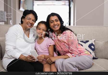 To use this stock image in your creative project, please select the size you need over to the right and click the "Add to Cart" button.
Your downloaded image will come with the Cutcaster watermark removed so don’t worry about the watermark you see on this page. Portrait of smiling multi-generation family sitting together on sofa stock photo, Portrait of smiling multi-generation family sitting together on sofa at home by Wavebreak Media