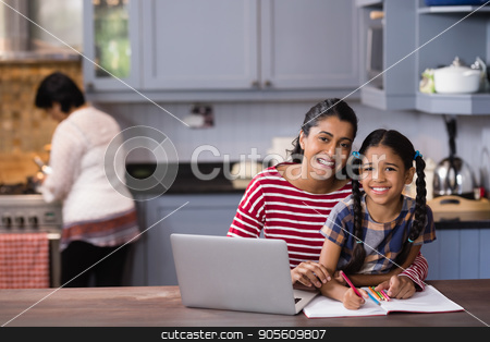 To use this stock image in your creative project, please select the size you need over to the right and click the "Add to Cart" button.
Your downloaded image will come with the Cutcaster watermark removed so don’t worry about the watermark you see on this page. Portrait of smiling girl with mother studying in kitchen stock photo, Portrait of smiling girl with mother studying in kitchen at home by Wavebreak Media