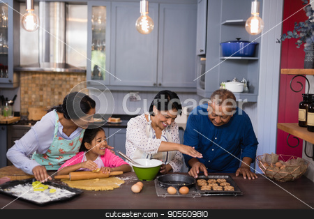To use this stock image in your creative project, please select the size you need over to the right and click the "Add to Cart" button.
Your downloaded image will come with the Cutcaster watermark removed so don’t worry about the watermark you see on this page. Happy multi-generation family preparing cookies in kitchen stock photo, Happy multi-generation family preparing cookies in kitchen at home by Wavebreak Media