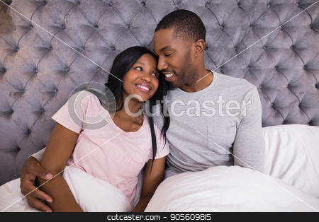 To use this stock image in your creative project, please select the size you need over to the right and click the "Add to Cart" button.
Your downloaded image will come with the Cutcaster watermark removed so don’t worry about the watermark you see on this page. Smiling couple embracing while sitting on bed stock photo, Smiling couple embracing while sitting together on bed at home by Wavebreak Media