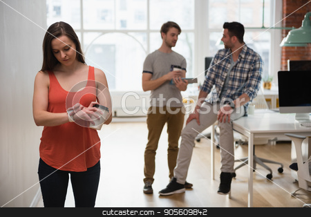 To use this stock image in your creative project, please select the size you need over to the right and click the "Add to Cart" button.
Your downloaded image will come with the Cutcaster watermark removed so don’t worry about the watermark you see on this page. Female executive adjusting a smart watch while colleague discussing in background stock photo, Female executive adjusting a smart watch while colleague discussing in background at office by Wavebreak Media