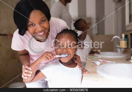 To use this stock image in your creative project, please select the size you need over to the right and click the "Add to Cart" button.
Your downloaded image will come with the Cutcaster watermark removed so don’t worry about the watermark you see on this page. Smiling mother with daughter brushing teeth in bathroom at home stock photo, Portrait of smiling mother with daughter brushing teeth in bathroom at home by Wavebreak Media
