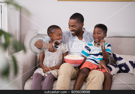 To use this stock image in your creative project, please select the size you need over to the right and click the "Add to Cart" button.
Your downloaded image will come with the Cutcaster watermark removed so don’t worry about the watermark you see on this page. Cheerful father and children with popcorn sitting on sofa stock photo, Cheerful father and children with popcorn sitting on sofa at home by Wavebreak Media