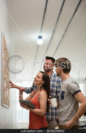 To use this stock image in your creative project, please select the size you need over to the right and click the "Add to Cart" button.
Your downloaded image will come with the Cutcaster watermark removed so don’t worry about the watermark you see on this page. Executives discussing over bulletin board stock photo, Executives discussing over bulletin board in office by Wavebreak Media