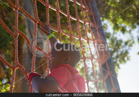 To use this stock image in your creative project, please select the size you need over to the right and click the "Add to Cart" button.
Your downloaded image will come with the Cutcaster watermark removed so don’t worry about the watermark you see on this page. Boy climbing a net during obstacle course training stock photo, Boy climbing a net during obstacle course training in the boot camp by Wavebreak Media
