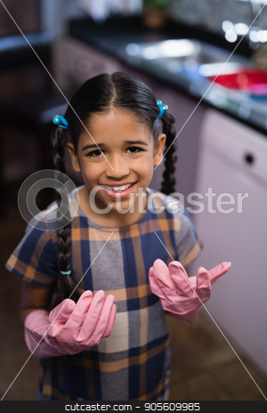To use this stock image in your creative project, please select the size you need over to the right and click the "Add to Cart" button.
Your downloaded image will come with the Cutcaster watermark removed so don’t worry about the watermark you see on this page. Portrait of smiling girl wearing pink gloves in kitchen stock photo, Portrait of smiling girl wearing pink rubber gloves in kitchen at home by Wavebreak Media
