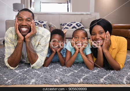 To use this stock image in your creative project, please select the size you need over to the right and click the "Add to Cart" button.
Your downloaded image will come with the Cutcaster watermark removed so don’t worry about the watermark you see on this page. Portrait of smiling family lying on rug stock photo, Portrait of smiling family lying on rug at home by Wavebreak Media