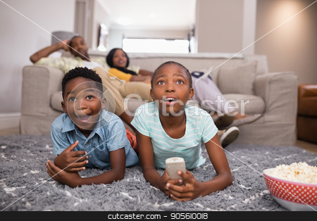 To use this stock image in your creative project, please select the size you need over to the right and click the "Add to Cart" button.
Your downloaded image will come with the Cutcaster watermark removed so don’t worry about the watermark you see on this page. Children watching television while parents sitting at home stock photo, Surprised children watching television while parents sitting at home by Wavebreak Media