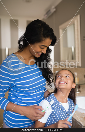 To use this stock image in your creative project, please select the size you need over to the right and click the "Add to Cart" button.
Your downloaded image will come with the Cutcaster watermark removed so don’t worry about the watermark you see on this page. Girl with mother holding toothbrushes in bathroom stock photo, Smiling girl with mother holding toothbrushes in bathroom by Wavebreak Media