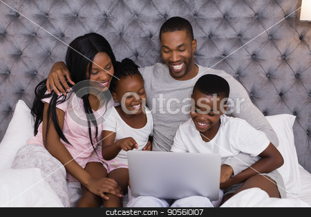 To use this stock image in your creative project, please select the size you need over to the right and click the "Add to Cart" button.
Your downloaded image will come with the Cutcaster watermark removed so don’t worry about the watermark you see on this page. Happy family using laptop together on bed stock photo, Happy family using laptop together while sitting on bed at home by Wavebreak Media
