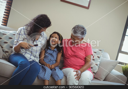To use this stock image in your creative project, please select the size you need over to the right and click the "Add to Cart" button.
Your downloaded image will come with the Cutcaster watermark removed so don’t worry about the watermark you see on this page. Smiling family watching television together in living room stock photo, Smiling family watching television together in living room at home by Wavebreak Media