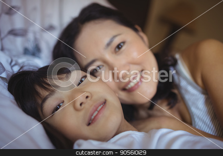 To use this stock image in your creative project, please select the size you need over to the right and click the "Add to Cart" button.
Your downloaded image will come with the Cutcaster watermark removed so don’t worry about the watermark you see on this page. Mother and daughter relaxing on bed in bed room stock photo, Portrait of mother and daughter relaxing on bed in bed room at home by Wavebreak Media
