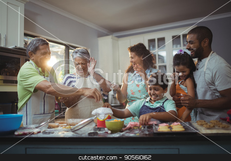 To use this stock image in your creative project, please select the size you need over to the right and click the "Add to Cart" button.
Your downloaded image will come with the Cutcaster watermark removed so don’t worry about the watermark you see on this page. Happy family preparing dessert in kitchen stock photo, Happy family preparing dessert in kitchen at home by Wavebreak Media