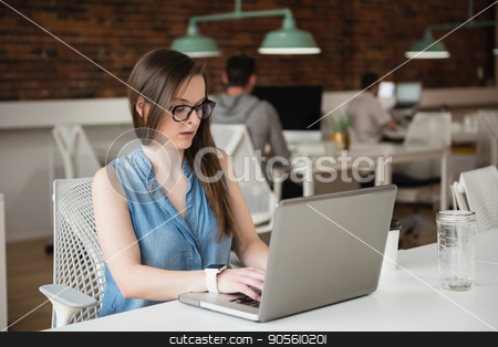 To use this stock image in your creative project, please select the size you need over to the right and click the "Add to Cart" button.
Your downloaded image will come with the Cutcaster watermark removed so don’t worry about the watermark you see on this page. Female executive working on laptop stock photo, Female executive working on laptop in office by Wavebreak Media
