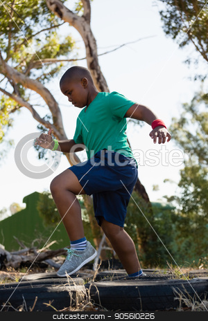 To use this stock image in your creative project, please select the size you need over to the right and click the "Add to Cart" button.
Your downloaded image will come with the Cutcaster watermark removed so don’t worry about the watermark you see on this page. Boy running over tyres during obstacle course training stock photo, Boy running over tyres during obstacle course training in the boot camp by Wavebreak Media