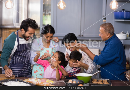 To use this stock image in your creative project, please select the size you need over to the right and click the "Add to Cart" button.
Your downloaded image will come with the Cutcaster watermark removed so don’t worry about the watermark you see on this page. Happy multi-generation family enjoying together in kitchen stock photo, Happy multi-generation family enjoying together in kitchen at home by Wavebreak Media
