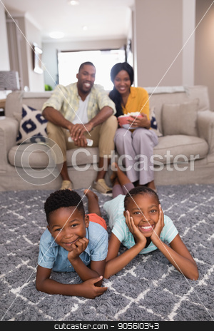To use this stock image in your creative project, please select the size you need over to the right and click the "Add to Cart" button.
Your downloaded image will come with the Cutcaster watermark removed so don’t worry about the watermark you see on this page. Happy family spending leisure time at home stock photo, Portrait of happy family spending leisure time at home by Wavebreak Media