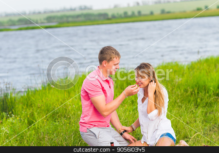 To use this stock image in your creative project, please select the size you need over to the right and click the "Add to Cart" button.
Your downloaded image will come with the Cutcaster watermark removed so don’t worry about the watermark you see on this page. Young couple in summer meadow, man and woman having romantic picnic stock photo, Young couple in summer meadow, man and woman having romantic picnic by Satura86