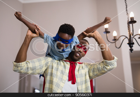 To use this stock image in your creative project, please select the size you need over to the right and click the "Add to Cart" button.
Your downloaded image will come with the Cutcaster watermark removed so don’t worry about the watermark you see on this page. Father and son wearing superhero costume at home stock photo, Playful father and son wearing superhero costume at home by Wavebreak Media