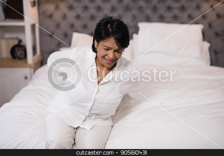 To use this stock image in your creative project, please select the size you need over to the right and click the "Add to Cart" button.
Your downloaded image will come with the Cutcaster watermark removed so don’t worry about the watermark you see on this page. Mature woman suffering with back pain stock photo, High angle view of mature woman suffering with back pain by Wavebreak Media