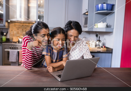 To use this stock image in your creative project, please select the size you need over to the right and click the "Add to Cart" button.
Your downloaded image will come with the Cutcaster watermark removed so don’t worry about the watermark you see on this page. Smiling multi-generation family using laptop in kitchen stock photo, Smiling multi-generation family using laptop together in kitchen at home by Wavebreak Media