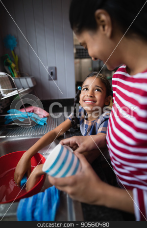 To use this stock image in your creative project, please select the size you need over to the right and click the "Add to Cart" button.
Your downloaded image will come with the Cutcaster watermark removed so don’t worry about the watermark you see on this page. Cute smiling girl helping her mother in kitchen stock photo, Cute smiling girl helping her mother in kitchen at home by Wavebreak Media