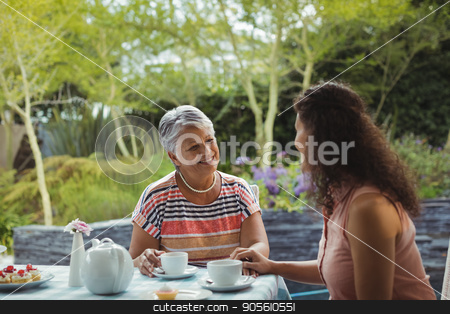 To use this stock image in your creative project, please select the size you need over to the right and click the "Add to Cart" button.
Your downloaded image will come with the Cutcaster watermark removed so don’t worry about the watermark you see on this page. Mother and daughter having tea stock photo, Mother and daughter having tea at home by Wavebreak Media