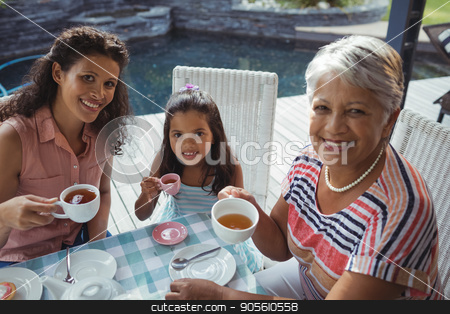 To use this stock image in your creative project, please select the size you need over to the right and click the "Add to Cart" button.
Your downloaded image will come with the Cutcaster watermark removed so don’t worry about the watermark you see on this page. Happy family having tea stock photo, Portrait of happy family having tea at home by Wavebreak Media