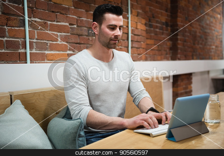 To use this stock image in your creative project, please select the size you need over to the right and click the "Add to Cart" button.
Your downloaded image will come with the Cutcaster watermark removed so don’t worry about the watermark you see on this page. Male executive using digital tablet at desk stock photo, Male executive using digital tablet at desk in office by Wavebreak Media