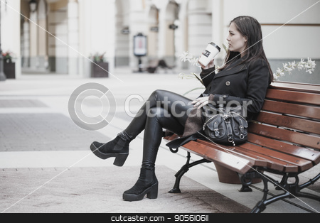 To use this stock image in your creative project, please select the size you need over to the right and click the "Add to Cart" button.
Your downloaded image will come with the Cutcaster watermark removed so don’t worry about the watermark you see on this page. Young Woman drinks coffee outdoors stock photo, Lifestyle young woman with coffee sitting outdoor by bvb1981