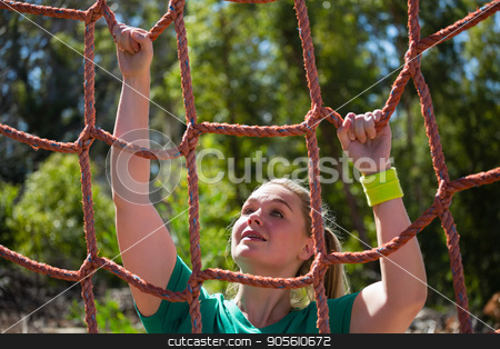 To use this stock image in your creative project, please select the size you need over to the right and click the "Add to Cart" button.
Your downloaded image will come with the Cutcaster watermark removed so don’t worry about the watermark you see on this page. Determined woman climbing a net during obstacle course training stock photo, Determined woman climbing a net during obstacle course training in the boot camp by Wavebreak Media