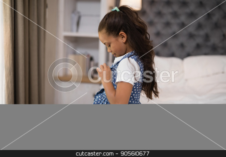 To use this stock image in your creative project, please select the size you need over to the right and click the "Add to Cart" button.
Your downloaded image will come with the Cutcaster watermark removed so don’t worry about the watermark you see on this page. Girl dressing up while sitting on bed at home stock photo, Side view of girl dressing up while sitting on bed at home by Wavebreak Media