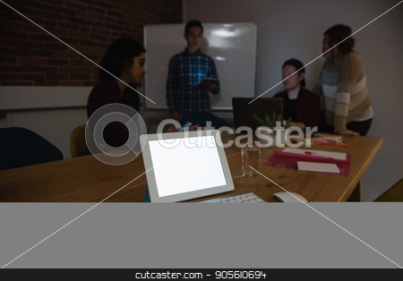 To use this stock image in your creative project, please select the size you need over to the right and click the "Add to Cart" button.
Your downloaded image will come with the Cutcaster watermark removed so don’t worry about the watermark you see on this page. Executive using digital tablet and colleagues discussing in background stock photo, Executive using digital tablet and colleagues discussing in background at office by Wavebreak Media