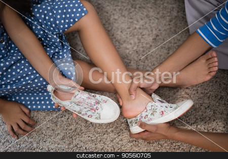 To use this stock image in your creative project, please select the size you need over to the right and click the "Add to Cart" button.
Your downloaded image will come with the Cutcaster watermark removed so don’t worry about the watermark you see on this page. Cropped image of mother helping daughter to wear shoe stock photo, Cropped image of mother helping daughter to wear shoe at home by Wavebreak Media