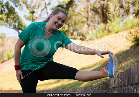 To use this stock image in your creative project, please select the size you need over to the right and click the "Add to Cart" button.
Your downloaded image will come with the Cutcaster watermark removed so don’t worry about the watermark you see on this page. Woman performing stretching exercise during obstacle course training stock photo, Woman performing stretching exercise during obstacle course training in the boot camp by Wavebreak Media