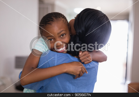 To use this stock image in your creative project, please select the size you need over to the right and click the "Add to Cart" button.
Your downloaded image will come with the Cutcaster watermark removed so don’t worry about the watermark you see on this page. Happy girl embracing mother in living room at home stock photo, Portrait of happy girl embracing mother in living room at home by Wavebreak Media