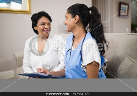To use this stock image in your creative project, please select the size you need over to the right and click the "Add to Cart" button.
Your downloaded image will come with the Cutcaster watermark removed so don’t worry about the watermark you see on this page. Smiling doctor with patient sitting on sofa stock photo, Smiling doctor with female patient sitting on sofa at home by Wavebreak Media