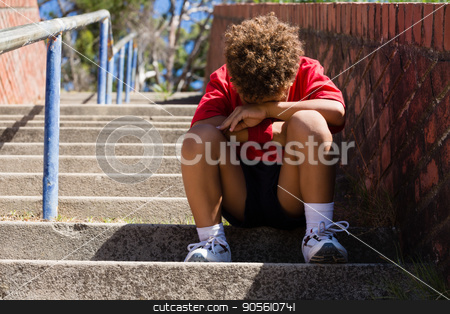 To use this stock image in your creative project, please select the size you need over to the right and click the "Add to Cart" button.
Your downloaded image will come with the Cutcaster watermark removed so don’t worry about the watermark you see on this page. Upset boy sitting on staircase in the boot camp stock photo, Upset boy sitting on staircase in the boot camp on a sunny day by Wavebreak Media