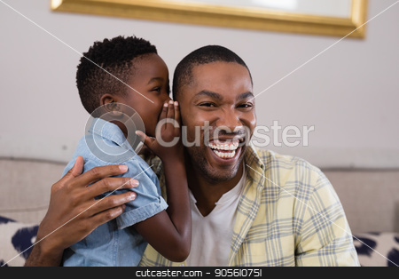 To use this stock image in your creative project, please select the size you need over to the right and click the "Add to Cart" button.
Your downloaded image will come with the Cutcaster watermark removed so don’t worry about the watermark you see on this page. Boy whispering father on sofa at home stock photo, Little boy whispering father on sofa at home by Wavebreak Media