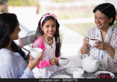 To use this stock image in your creative project, please select the size you need over to the right and click the "Add to Cart" button.
Your downloaded image will come with the Cutcaster watermark removed so don’t worry about the watermark you see on this page. Portrait of smiling girl having breakfast with mother and grandmother stock photo, Portrait of smiling girl having breakfast with mother and grandmother at home by Wavebreak Media