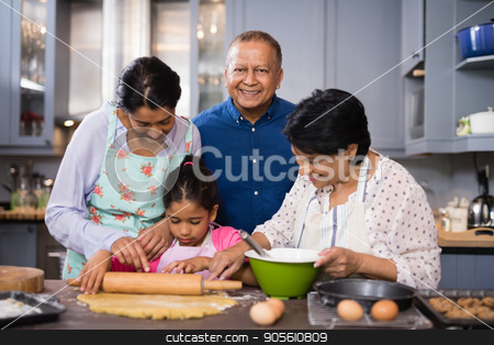 To use this stock image in your creative project, please select the size you need over to the right and click the "Add to Cart" button.
Your downloaded image will come with the Cutcaster watermark removed so don’t worry about the watermark you see on this page. Portrait of smiling man with family preparing food in kitchen stock photo, Portrait of smiling mature man standing with family preparing food in kitchen at home by Wavebreak Media