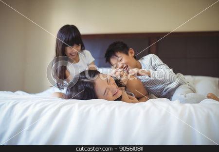 To use this stock image in your creative project, please select the size you need over to the right and click the "Add to Cart" button.
Your downloaded image will come with the Cutcaster watermark removed so don’t worry about the watermark you see on this page. Happy family having fun on bed in the bed room stock photo, Happy family relaxing on bed in the bed room at home by Wavebreak Media