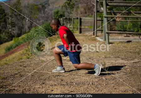 To use this stock image in your creative project, please select the size you need over to the right and click the "Add to Cart" button.
Your downloaded image will come with the Cutcaster watermark removed so don’t worry about the watermark you see on this page. Boy performing stretching exercise during obstacle course training stock photo, Boy performing stretching exercise during obstacle course training in the boot camp by Wavebreak Media