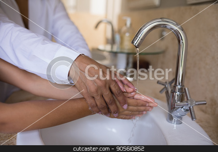 To use this stock image in your creative project, please select the size you need over to the right and click the "Add to Cart" button.
Your downloaded image will come with the Cutcaster watermark removed so don’t worry about the watermark you see on this page. Mid section of granny helping girl while washing hands at sink stock photo, Mid section of granny helping girl while washing hands at sink in bathroom by Wavebreak Media