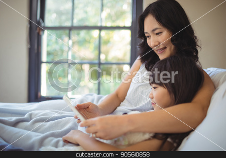 To use this stock image in your creative project, please select the size you need over to the right and click the "Add to Cart" button.
Your downloaded image will come with the Cutcaster watermark removed so don’t worry about the watermark you see on this page. Mother and daughter using digital tablet on bed in bed room stock photo, Mother and daughter using digital tablet on bed in bed room at home by Wavebreak Media