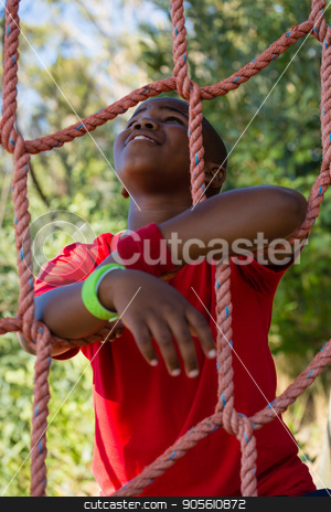 To use this stock image in your creative project, please select the size you need over to the right and click the "Add to Cart" button.
Your downloaded image will come with the Cutcaster watermark removed so don’t worry about the watermark you see on this page. Happy boy leaning on net during obstacle course stock photo, Happy boy leaning on net during obstacle course in the boot camp by Wavebreak Media