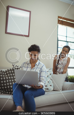 To use this stock image in your creative project, please select the size you need over to the right and click the "Add to Cart" button.
Your downloaded image will come with the Cutcaster watermark removed so don’t worry about the watermark you see on this page. Mother and daughter using laptop in living room stock photo, Mother and daughter using laptop in living room at home by Wavebreak Media