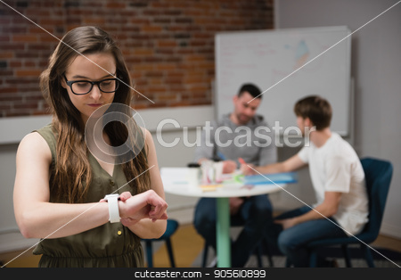 To use this stock image in your creative project, please select the size you need over to the right and click the "Add to Cart" button.
Your downloaded image will come with the Cutcaster watermark removed so don’t worry about the watermark you see on this page. Female executive adjusting a smart watch while colleague discussing in background stock photo, Female executive adjusting a smart watch while colleague discussing in background at office by Wavebreak Media