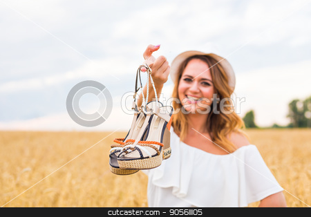 To use this stock image in your creative project, please select the size you need over to the right and click the "Add to Cart" button.
Your downloaded image will come with the Cutcaster watermark removed so don’t worry about the watermark you see on this page. Young woman holding a shoe - sale, consumerism and people concept stock photo, Young woman holding a shoe - sale, consumerism and people concept by Satura86